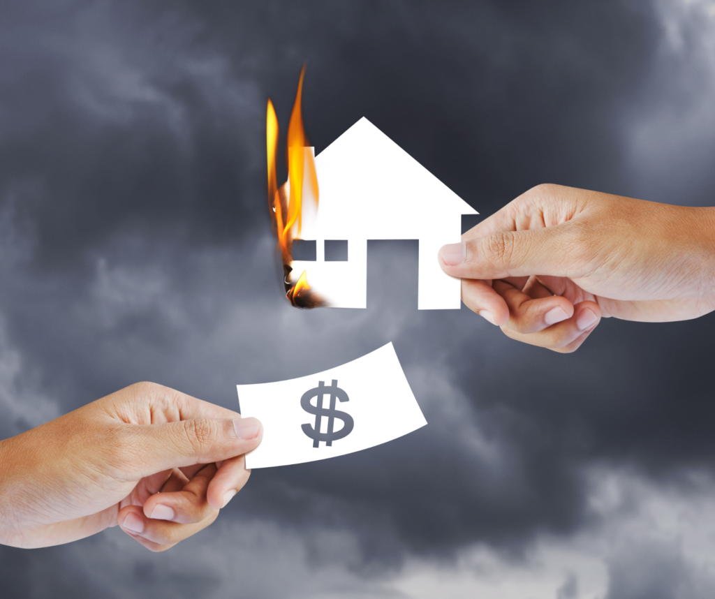 Two huts facing each other, one on fire and the other offering a dollar-signed document as protection